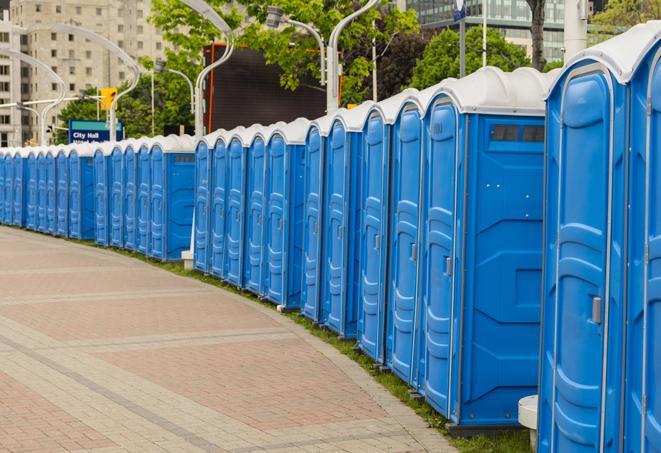 a row of portable restrooms at an outdoor special event, ready for use in Brea